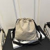 Lightweight Nylon Crossbody Bucket Bag – Large Capacity Drawstring Shoulder Bag with Pendant Charm, Sporty Casual