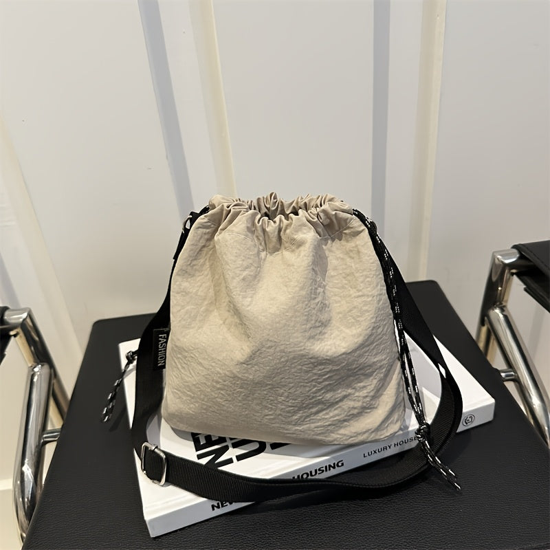 Lightweight Nylon Crossbody Bucket Bag – Large Capacity Drawstring Shoulder Bag with Pendant Charm, Sporty Casual