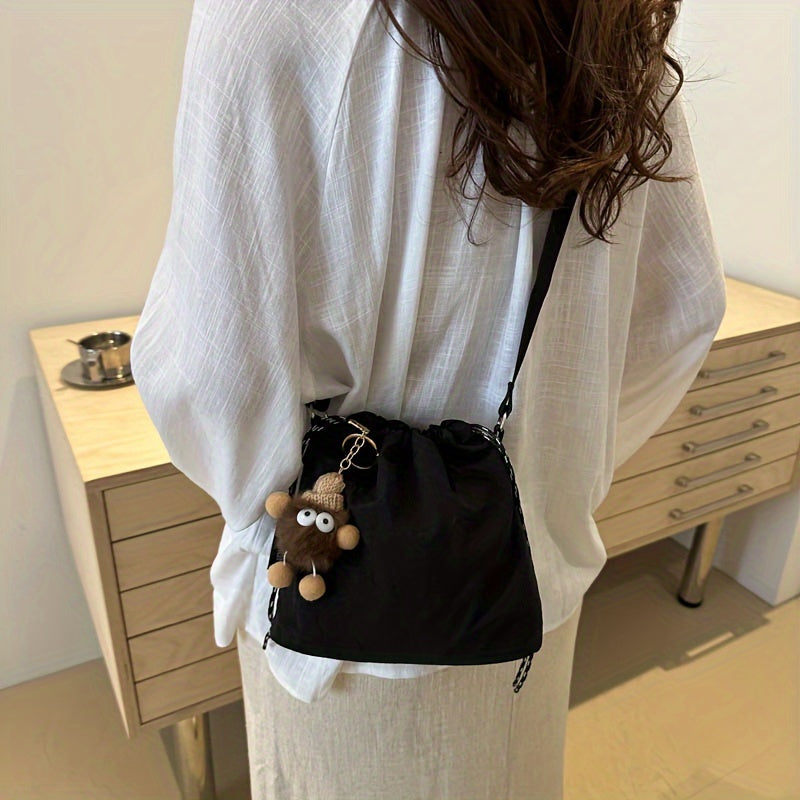 Lightweight Nylon Crossbody Bucket Bag – Large Capacity Drawstring Shoulder Bag with Pendant Charm, Sporty Casual