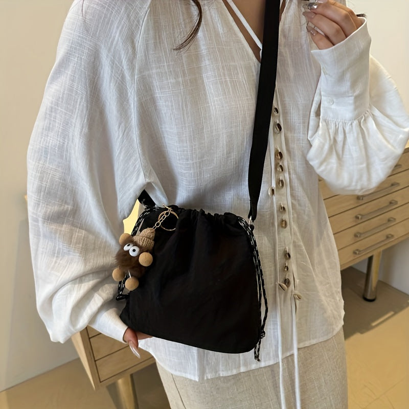 Lightweight Nylon Crossbody Bucket Bag – Large Capacity Drawstring Shoulder Bag with Pendant Charm, Sporty Casual