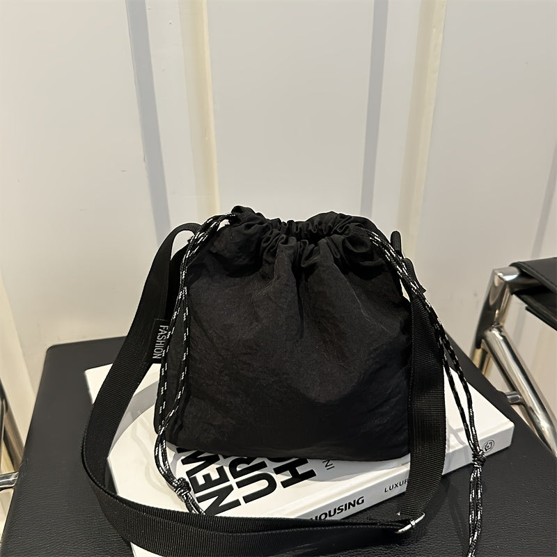 Lightweight Nylon Crossbody Bucket Bag – Large Capacity Drawstring Shoulder Bag with Pendant Charm, Sporty Casual