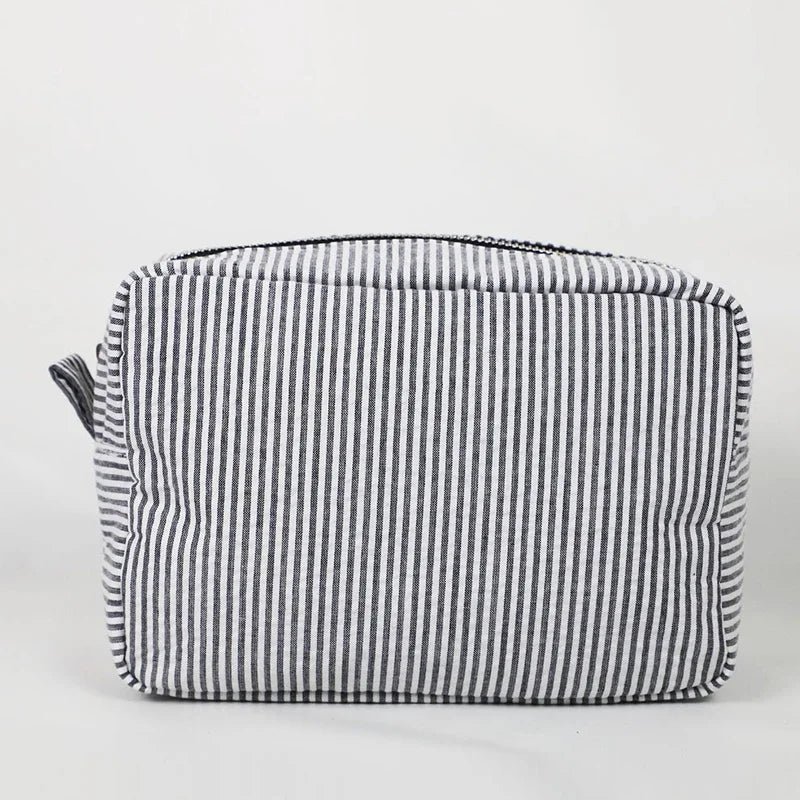 Seersucker Ruffle Makeup Bag — Pink & Purple Striped Zipper Pouch for Travel & Toiletries