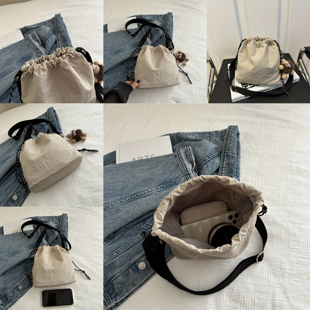Lightweight Nylon Crossbody Bucket Bag – Large Capacity Drawstring Shoulder Bag with Pendant Charm, Sporty Casual