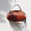 Women's Vintage Round Crossbody Bag – Small Faux Leather Baguette Purse with Buckle Closure (Black, Burgundy)
