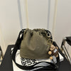 Lightweight Nylon Crossbody Bucket Bag – Large Capacity Drawstring Shoulder Bag with Pendant Charm, Sporty Casual