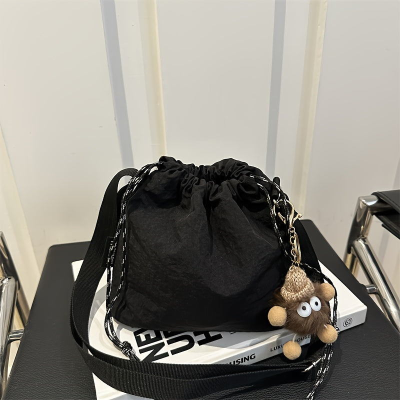 Lightweight Nylon Crossbody Bucket Bag – Large Capacity Drawstring Shoulder Bag with Pendant Charm, Sporty Casual